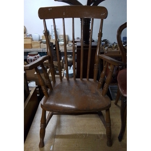 301 - An early 20th century Windsor painted armchair, with stick back and crinoline stretcher, on turned l... 