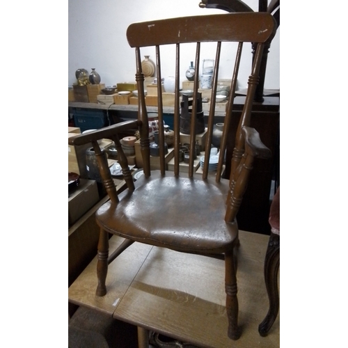 301 - An early 20th century Windsor painted armchair, with stick back and crinoline stretcher, on turned l... 