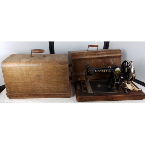 303 - A Vibra hand-cranked sewing machine, black japanned metal with gilt and polychrome floral decoration... 