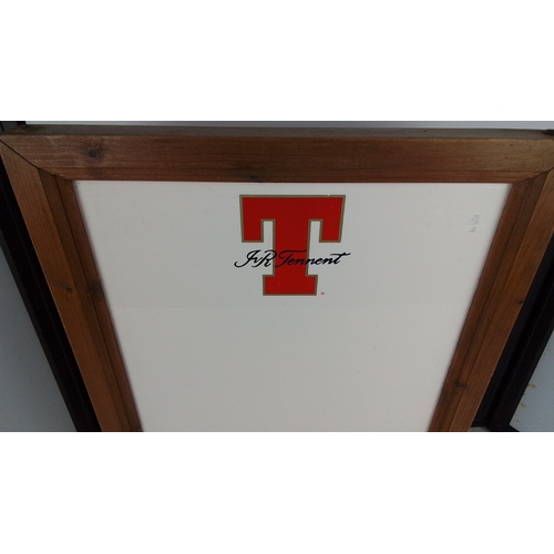 307 - A framed advertising white board for J.R. Tennett, bearing a large red letter 