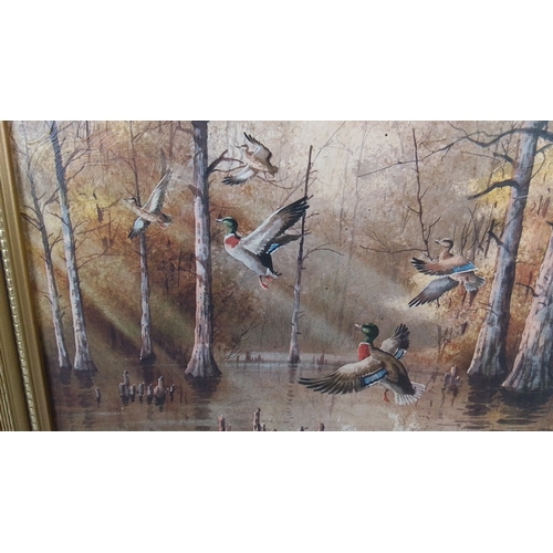 320 - A framed print depicting mallards in flight over a wooded marsh landscape, signed lower right “Paul ... 