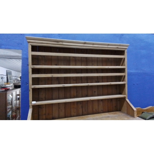 322 - A stunning large antique pine dresser, open plate rack superstructure, having moulded cornice, five ... 