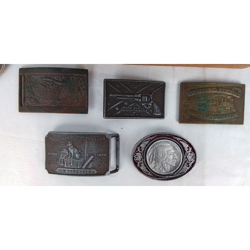 358 - Group of five novelty belt buckles, including Wells Fargo and Company and Jesse James designs, and a... 