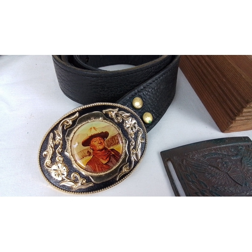 358 - Group of five novelty belt buckles, including Wells Fargo and Company and Jesse James designs, and a... 