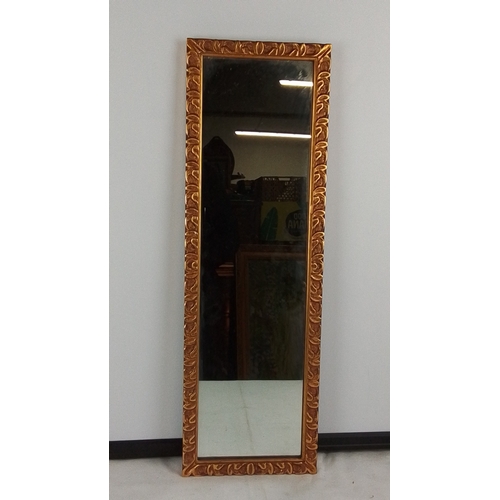 376 - A rectangular wall mirror with gilt carved scrolling foliate frame, the plate within a narrow inner ... 