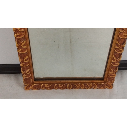 376 - A rectangular wall mirror with gilt carved scrolling foliate frame, the plate within a narrow inner ... 