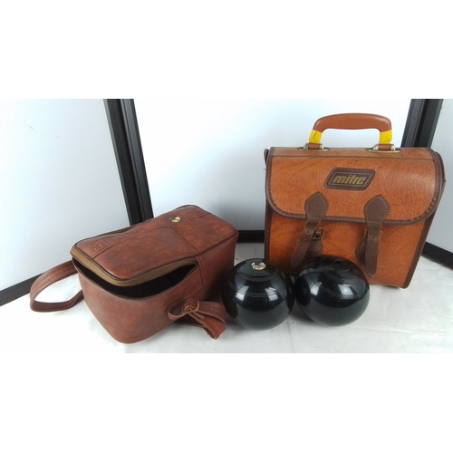 400 - Two sets of vintage carpet bowls and cases.