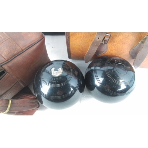 400 - Two sets of vintage carpet bowls and cases.