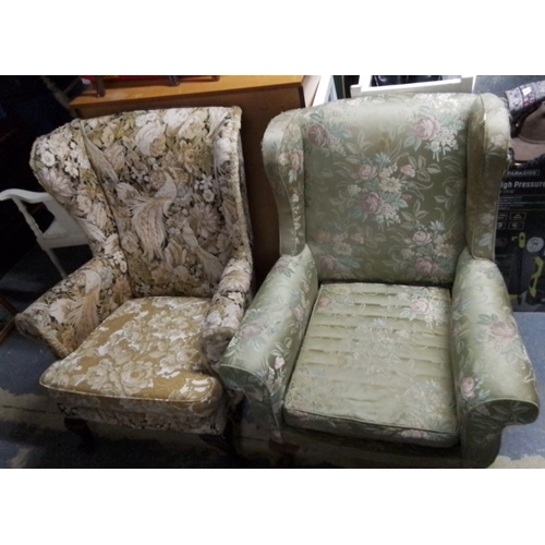 405 - Pair of upholstered wingback armchairs, one in green floral fabric with scroll arms, the other in ta... 