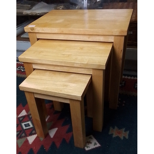 425 - Set of three graduated pine nesting tables, each rectangular with square-section legs, plain apron r... 