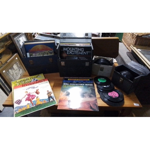 433 - Collection of vinyl records, including LPs and 45rpm singles, housed in three carry cases; visible t... 