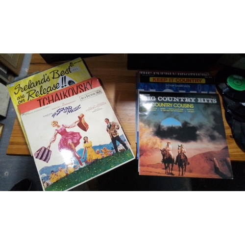 433 - Collection of vinyl records, including LPs and 45rpm singles, housed in three carry cases; visible t... 