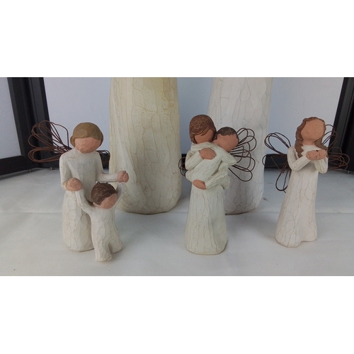Two large Willow Tree resin figures and three smaller figures.