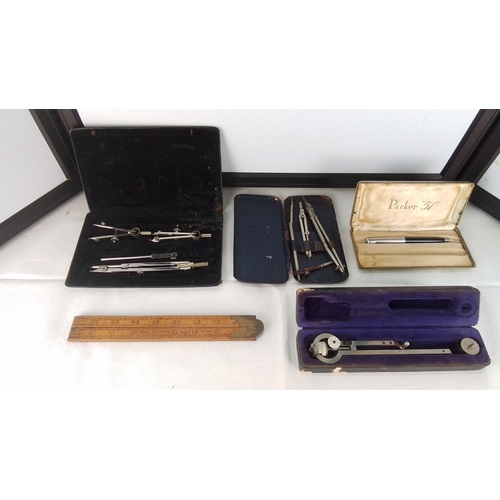 Group of technical drawing and measuring instruments, including two ...