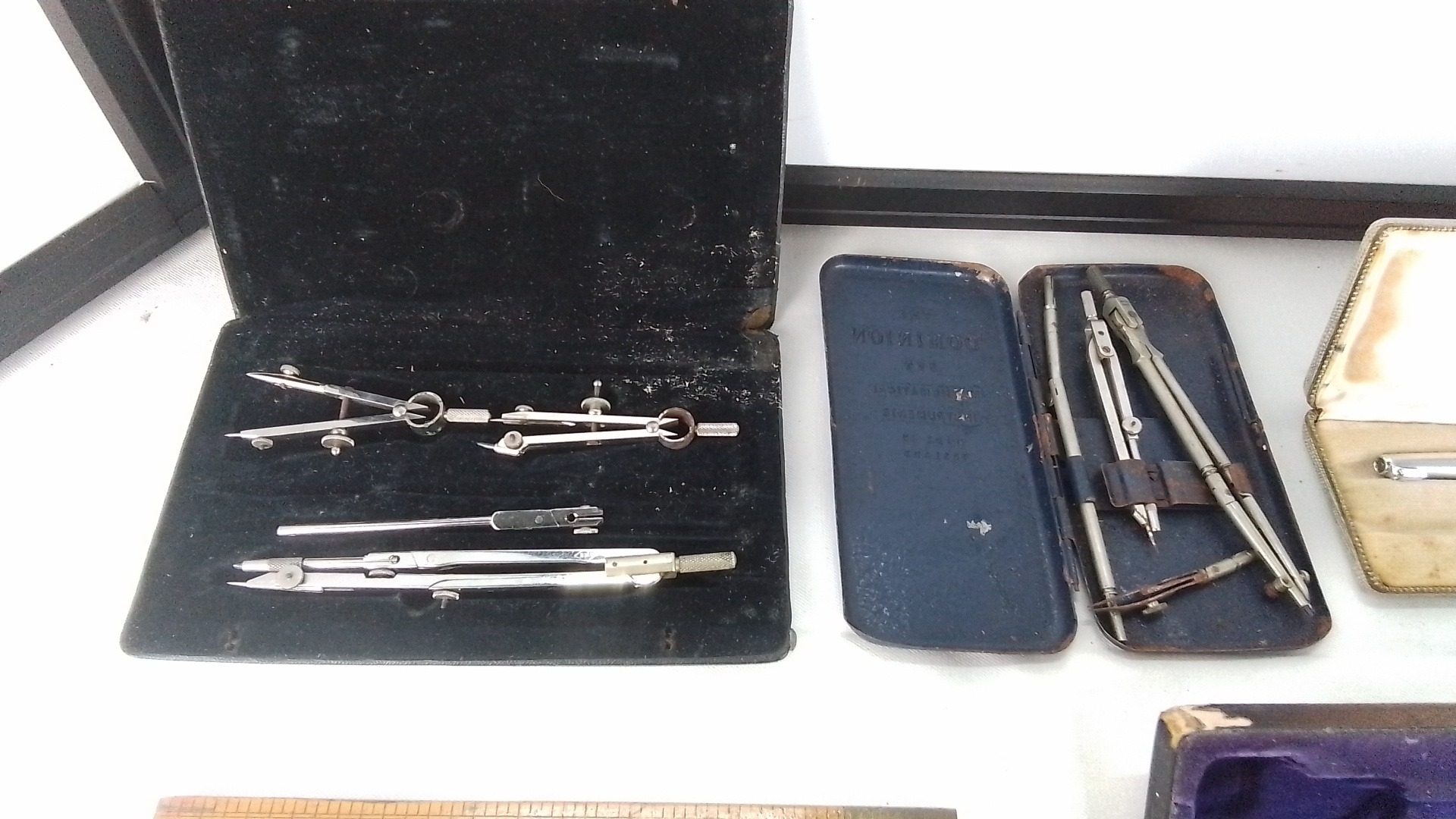 Group of technical drawing and measuring instruments, including two ...
