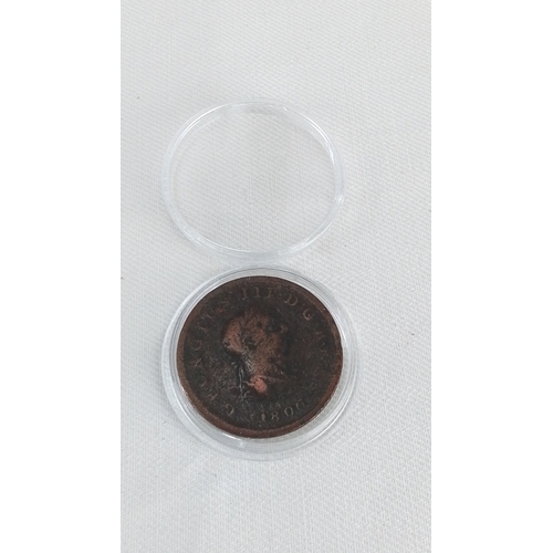 202 - An early George III copper penny coin, dated 1806, in a clear protective capsule; obverse with laure... 