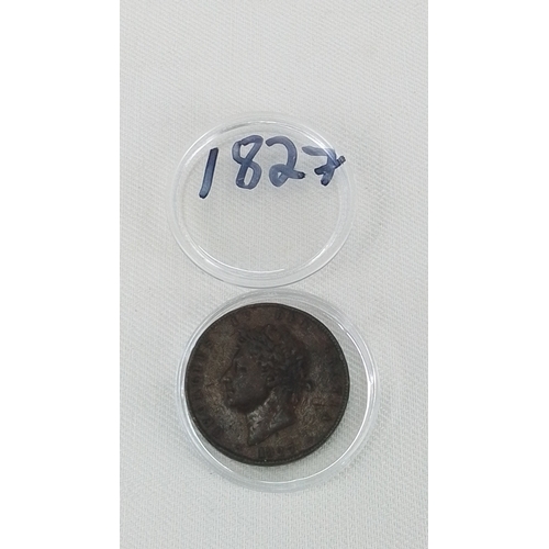 210 - A early 1827 George IV Milled Copper coin, cased in a clear capsule.
