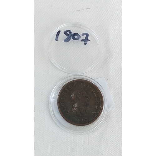 217 - An 1807 George III copper penny, obverse with laureate bust and legend, reverse depicting Britannia ... 