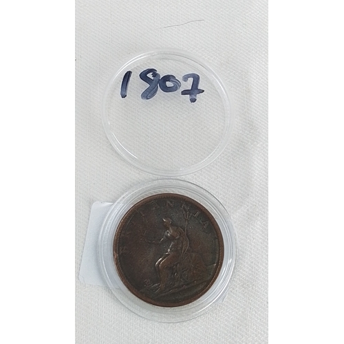 217 - An 1807 George III copper penny, obverse with laureate bust and legend, reverse depicting Britannia ... 