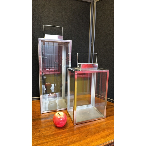 5 - Pair of contemporary glass and brushed steel lanterns, each of rectangular form with hinged access d... 