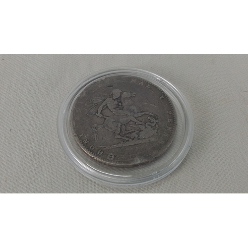 234 - A George III silver crown coin, 1820, laureate bust with Latin legend; reverse with St George slayin... 