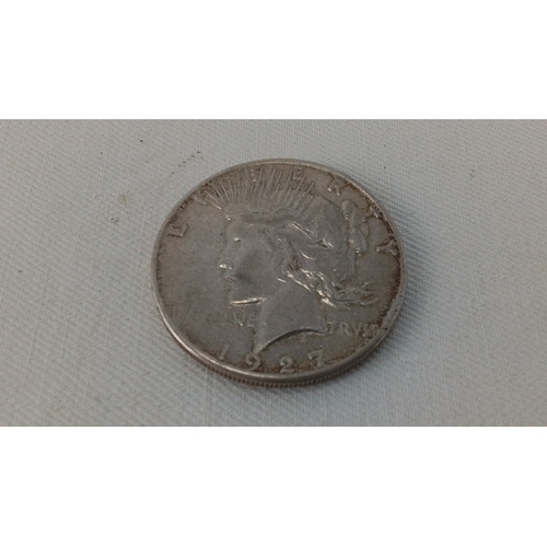 238 - One United States Peace silver dollar coin, dated 1927, with Liberty head obverse and eagle reverse ... 