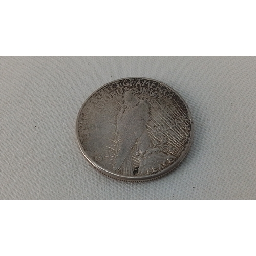 238 - One United States Peace silver dollar coin, dated 1927, with Liberty head obverse and eagle reverse ... 