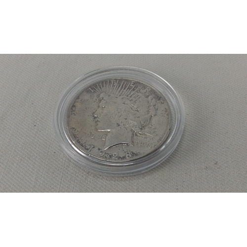 239 - A United States Peace silver dollar coin, dated 1928, showing the Liberty head obverse and eagle rev... 