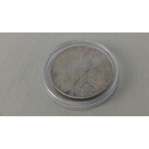 239 - A United States Peace silver dollar coin, dated 1928, showing the Liberty head obverse and eagle rev... 