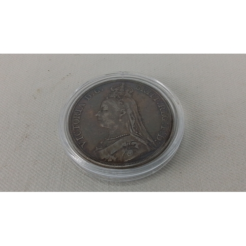 244 - An 1891 British silver Crown, featuring St George and the Dragon reverse and the veiled head portrai... 