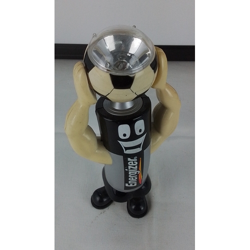 278 - A vintage Energizer battery mascot advertising figure, moulded in plastic with cartoon face and musc... 