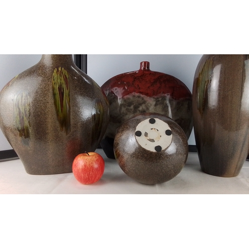 279 - Set of four pottery vessels comprising three baluster vases and a flattened bottle form, all in mott... 