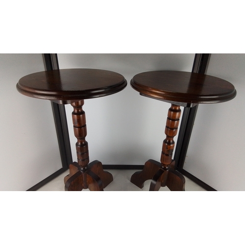 280 - Pair of small circular occasional wine tables in dark wood, each with a turned baluster column and s... 