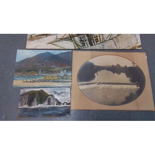 297 - Five unframed art works comprising two oils on board depicting coastal landscapes, an oval photograp... 