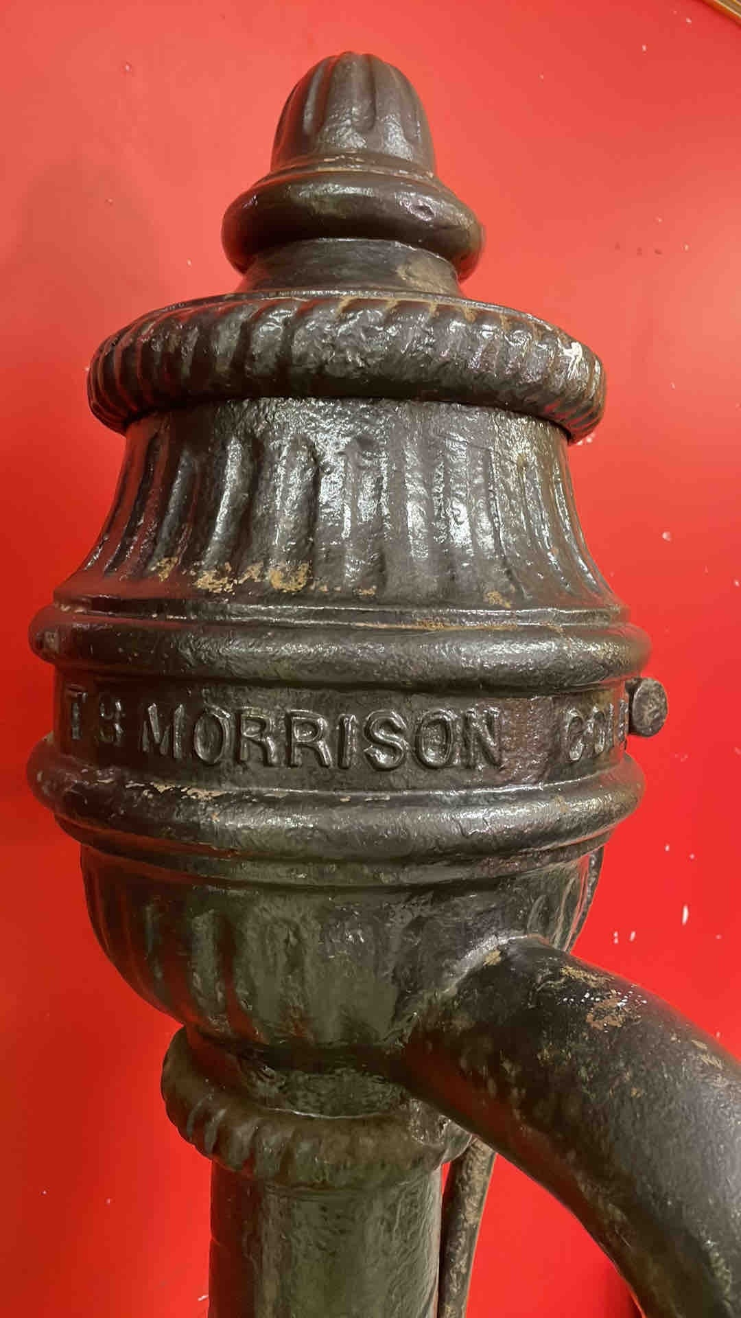 A Victorian cast-iron street hydrant or standpipe, with arched spout ...