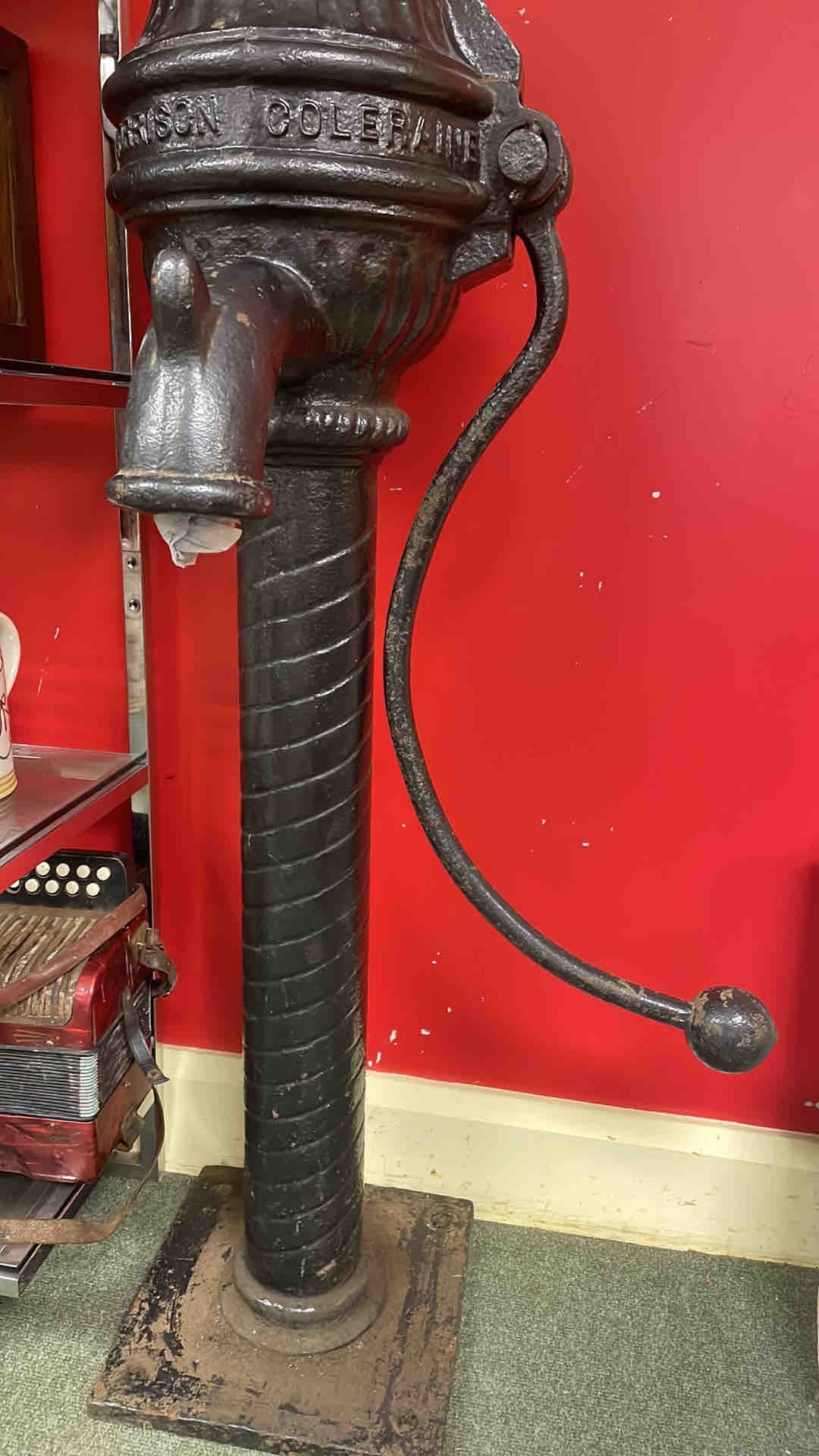 A Victorian cast-iron street hydrant or standpipe, with arched spout ...