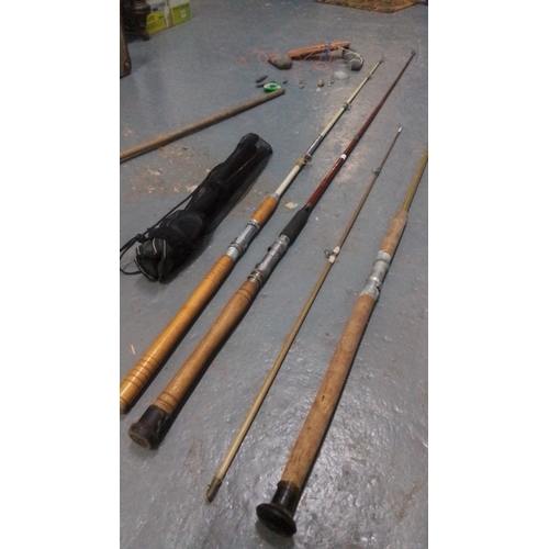 Group of fishing equipment including four mixed fishing rods, a landing ...