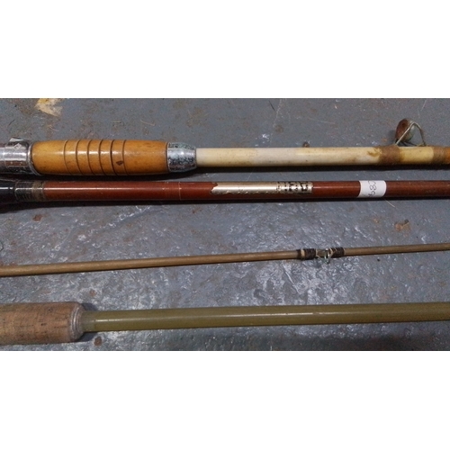 Group of fishing equipment including four mixed fishing rods, a landing ...