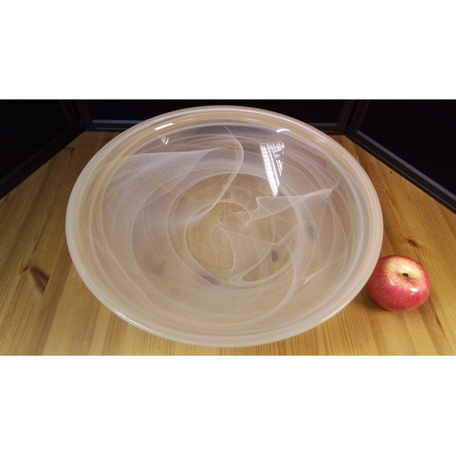 566 - A large contemporary art glass centre bowl of shallow circular form, the clear body with opaque whit... 