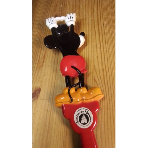 584 - A Walt Disney World Mickey Mouse plastic back-scratcher, modelled in relief with Mickey standing abo... 
