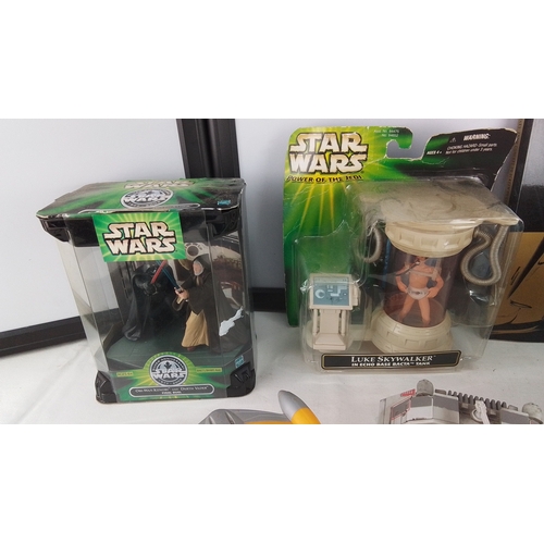 403 - A group of Star Wars collectibles, including boxed Hasbro figures, a Luke Skywalker in Echo Base Bac... 