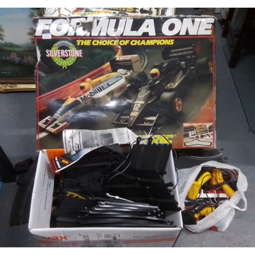 Formula One slot-car racing parts, including track sections, power hand ...