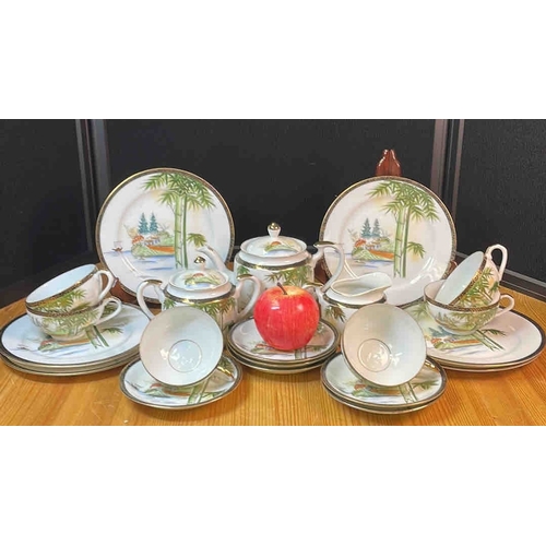 607 - A group of Kutani style Japanese porcelain tea and coffee wares, hand-painted with landscape scenes ... 