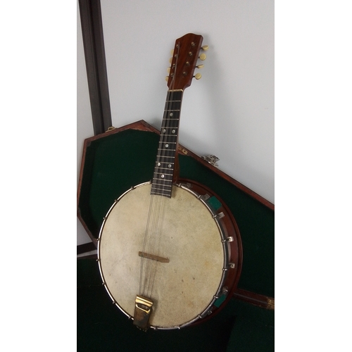 A Tenor Banjo with skin head, metal-rim tension hoop, dot-inlaid ...