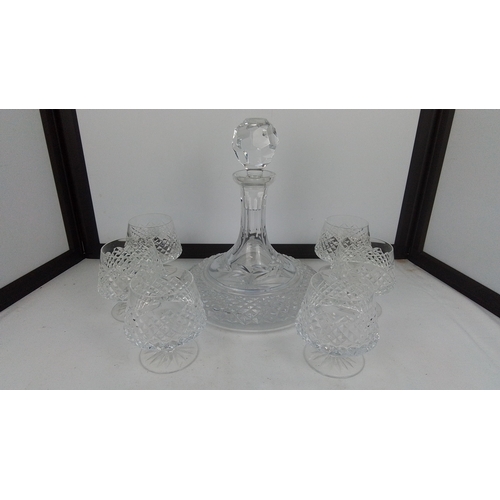 100 - A Galway crystal ships decanter and a set of six Tyrone crystal brandy glasses.