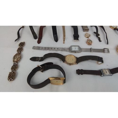 65 - A group of assorted wristwatches, including gold-tone and stainless-steel cases, leather straps, and... 
