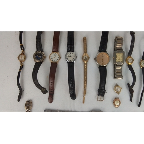 65 - A group of assorted wristwatches, including gold-tone and stainless-steel cases, leather straps, and... 
