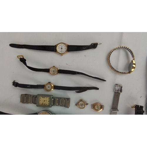 65 - A group of assorted wristwatches, including gold-tone and stainless-steel cases, leather straps, and... 