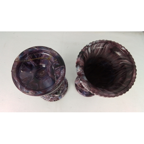 73 - A pair of marbled purple glass urn-form vases, each with a gadrooned everted rim above a moulded col... 