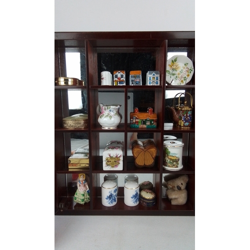 74 - A wall-mounted glazed wooden display cabinet fitted with compartmented interior, housing an assortme... 